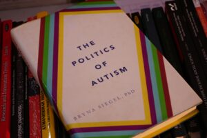 A book sitting on top of a pile of books