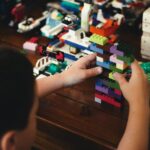 child playing with lego blocks