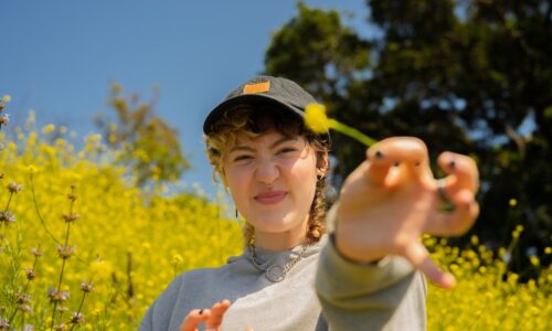 Portrait of a nonbinary autistic person outdoors