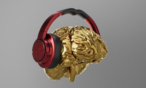 A pair of headphones that are gold and red