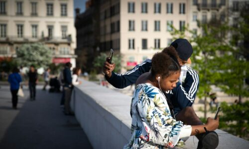 woman and man taking photos