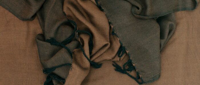 a pile of cloth sitting on top of a bed