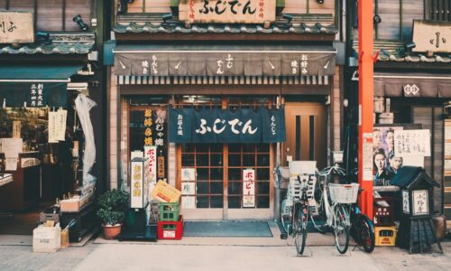three bicycles parked in front of building