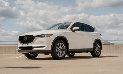 a white mazda cx - 5 parked in a parking lot