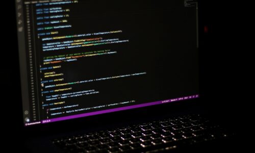 a laptop computer sitting on top of a desk