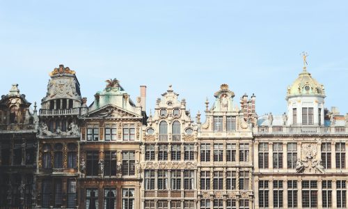 gray and brown building under blue sky