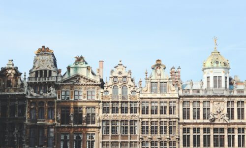 gray and brown building under blue sky